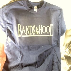 Gray custom  made shirt labeled “Band In the Hood”